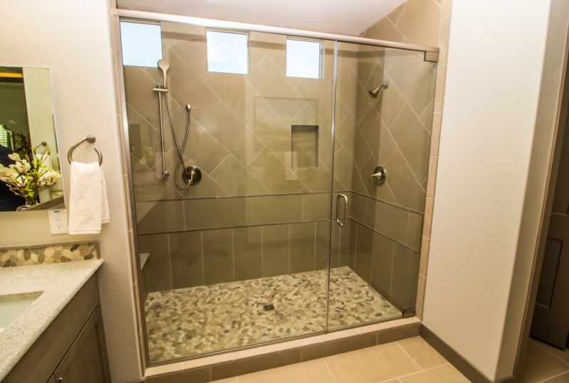 Walk-in shower with glass enclosure